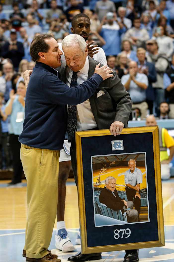 Scott Smith, son of Dean Smith, joined Roy Williams on the court.